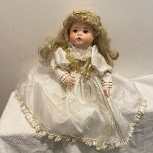 Porcelain Doll with Golden Outfit